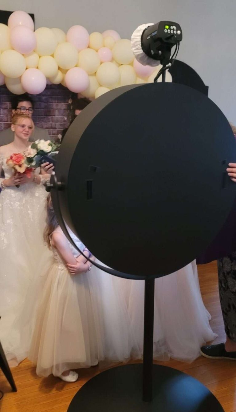 Bespoke Beauty Mirror Photo Booth set up at Copper Bell Speakeasy in Burnett, Wisconsin. Models are wearing wedding attire