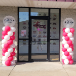 Festive pink and white classic balloon columns outside the 5678 Dance studio in Oconomowoc, Wisconsin.