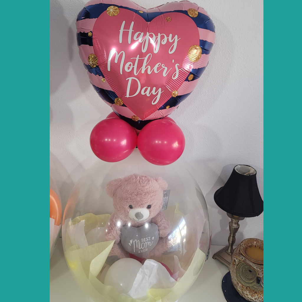Full view of a Mother's Day stuffed balloon gift with a heartwarming pink teddy bear inside, accompanied by pink latex balloons and a heart-shaped balloon.