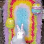 An Easter-themed backdrop with colorful fluff, created by GBF Bespoke Balloons, also ideal for unicorn or princess parties.