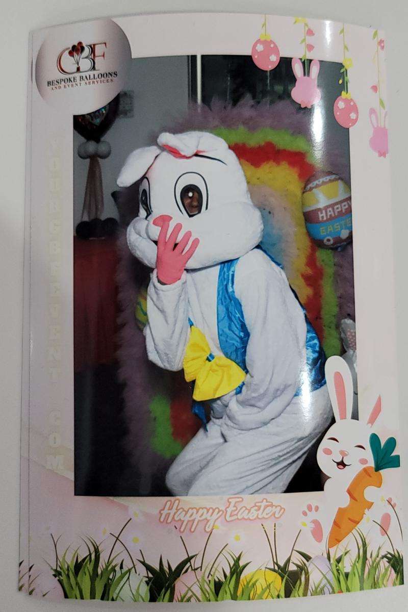 The Easter Bunny posing with GBF Bespoke Balloons' Beauty Mirror Photo Booth at the Easter Bunny Hop.