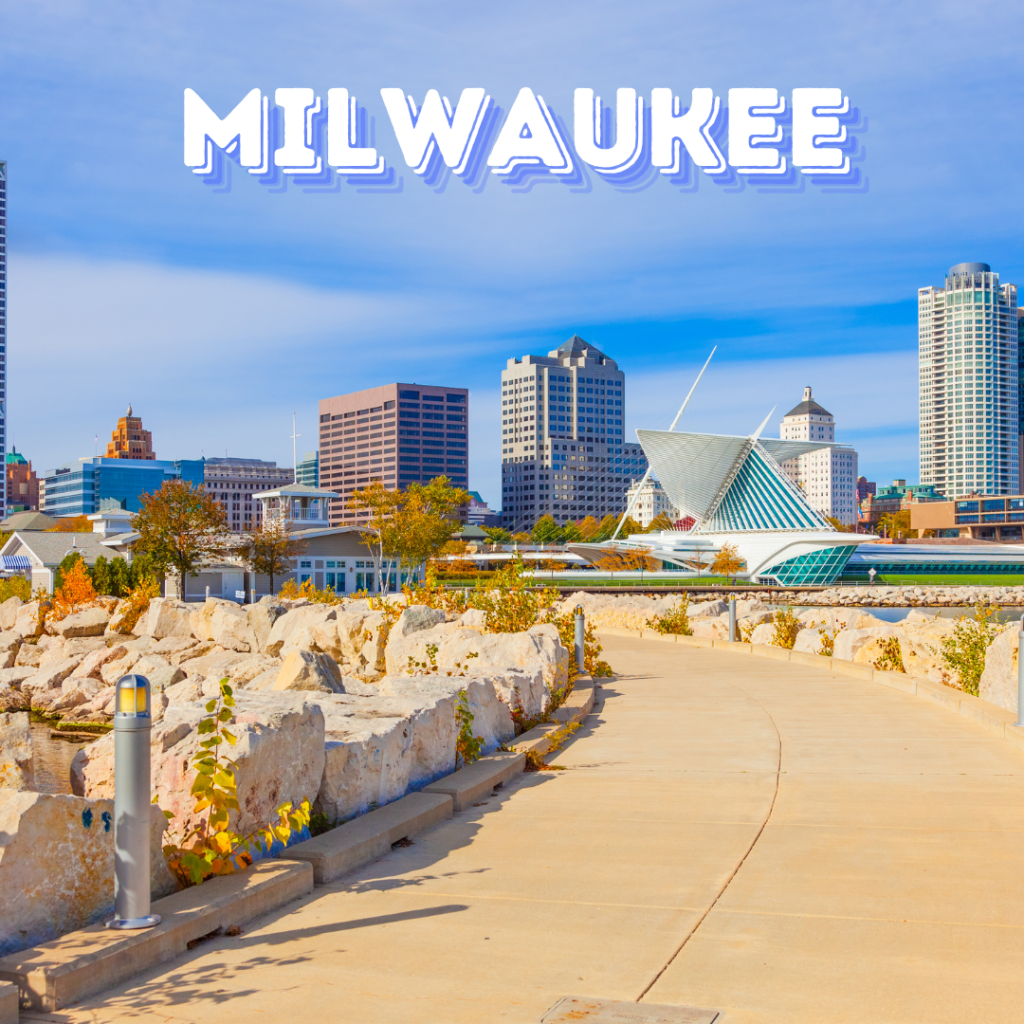 Milwaukee skyline with the Milwaukee Art Museum and city buildings on a sunny day.