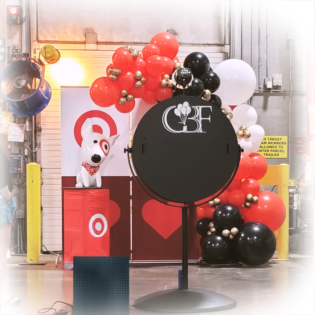 GBF Bespoke Balloons and Event Services photo booth setup at a Target event with a custom balloon arch and the GBF logo prominently displayed.