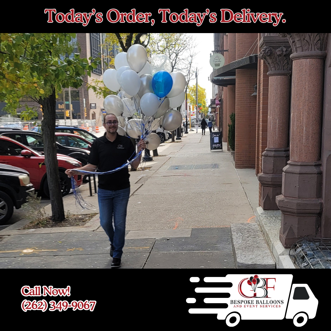 A delivery person from GBF Bespoke Balloons and Event Services delivering a balloon bouquet in Downtown Waukesha, Southeast Wisconsin