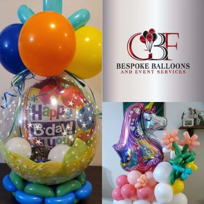 This picture depicts an oversized stuffed balloon with a foil balloon stuffed inside of the stuffed balloon. The foil balloon says "Happy Birthday" but can be custom to any occasion, This photo also displays a unicorn marquee balloon arrangement with a foil unicorn on a large balloon base display of white and pink balloons with a bouquet of balloon flowers next to the unicorn.